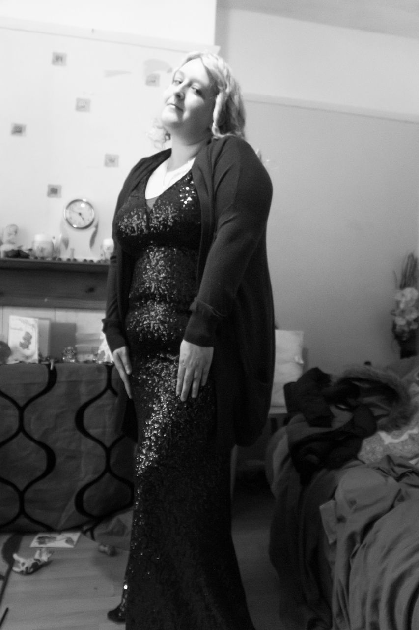 black, black and white, one person, adult, women, dress, indoors, monochrome photography, fashion, clothing, monochrome, standing, white, photo shoot, bride, female, young adult, lifestyles, full length, looking, gown, home interior, three quarter length, domestic room