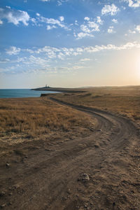 Scenic view of beach against sky during sunset