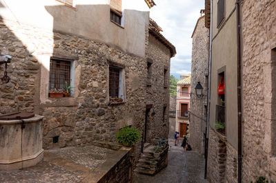 Narrow alley amidst old buildings in town