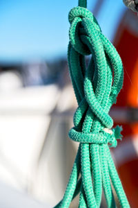 Close-up of rope tied to railing