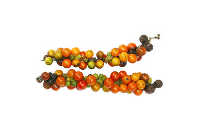 Close-up of berries against white background