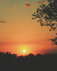 Scenic view of silhouette trees against romantic sky at sunset