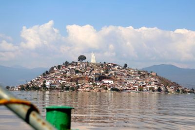 Panoramic view of townscape by sea against sky