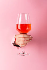 Close-up of red wine against white background