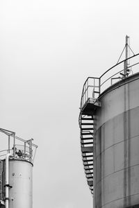 Low angle view of factory against clear sky