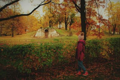 Man standing by trees during autumn