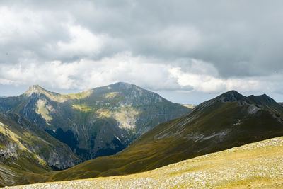 Scenic view of snowcapped mountains against sky in montemonaco, marche italy