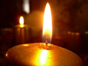 Close-up of lit tea light candle