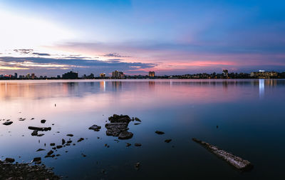 Scenic view of lake against sky during sunset