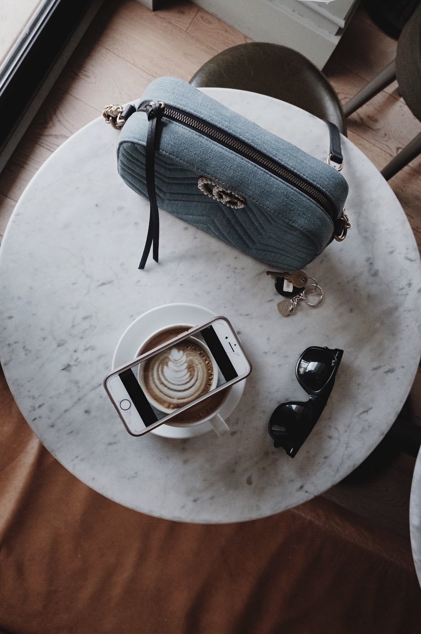 high angle view, table, indoors, still life, food and drink, no people, refreshment, drink, food, cup, close-up, freshness, coffee, plate, kitchen utensil, coffee cup, directly above, wood - material, coffee - drink, paper, crockery