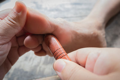 Close-up of person holding hands