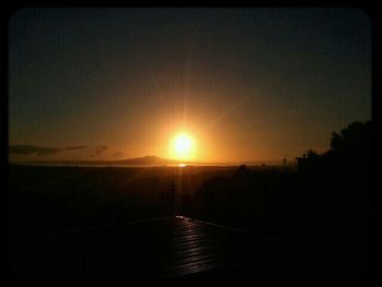 Sun shining over landscape