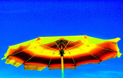 Low angle view of yellow structure against blue sky