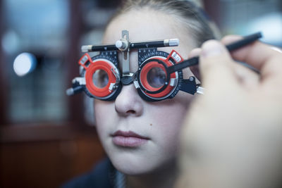 Girl doing eye test at optometrist