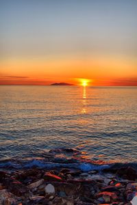 Scenic view of sea against sky during sunset