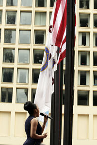 Woman standing in front of building