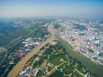 High angle view of buildings in city against sky