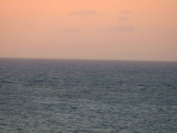 Scenic view of sea against clear sky during sunset