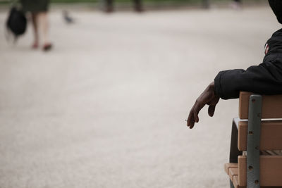 Close-up of hand on road