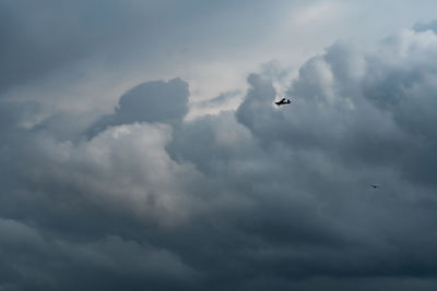 Low angle view of airplane flying in sky