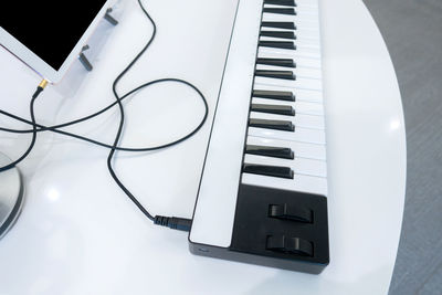High angle view of piano on table