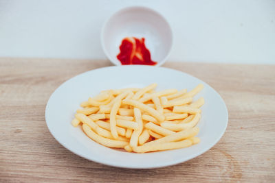 Close-up of fruit in plate on table