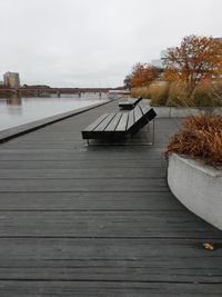 Pier over lake against sky