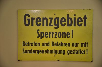 Close-up of warning sign on wall