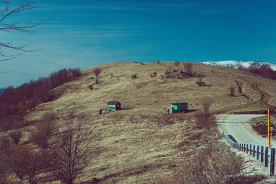 Scenic view of landscape against clear blue sky