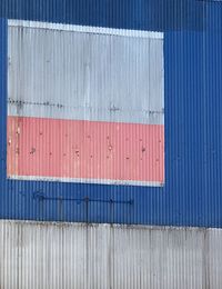 Metallic structure against blue sky