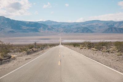 Road amidst landscape against sky