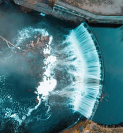 A long exposure drone shot of a waterfall at reddish vale, manchester, uk