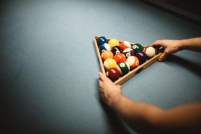 Person playing with ball on table