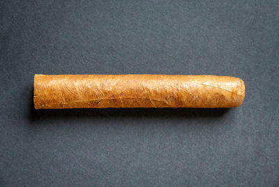 Directly above shot of bread against black background