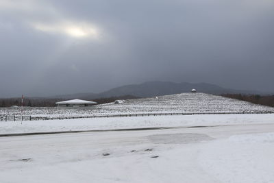 Scenic view of snow covered mountains against sky