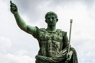 Low angle view of statue against sky