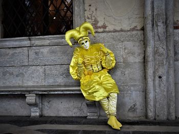 Man with yellow umbrella