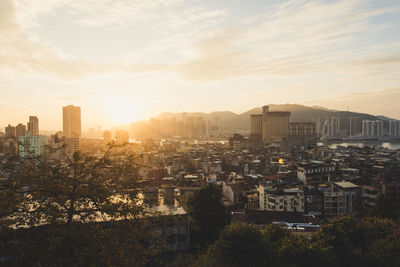 High angle view of buildings against sky during sunset