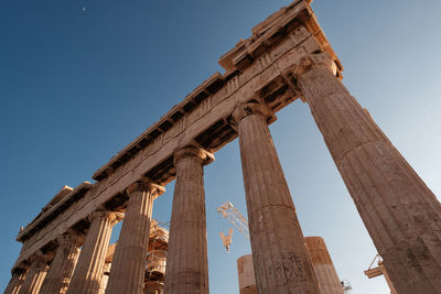 Low angle view of old ruins against clear sky