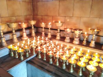 Illuminated candles on display