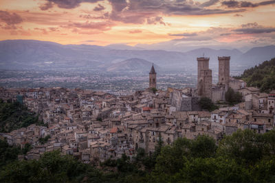 Aerial view of townscape against sky during sunset