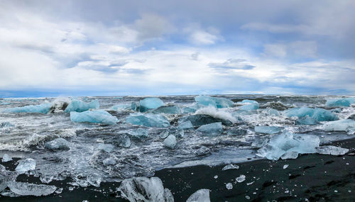 Scenic view of frozen sea against sky