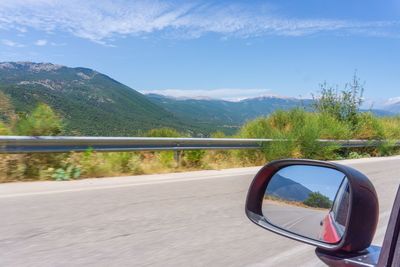 Reflection of road on side-view mirror