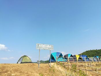 Lifeguard hut against clear blue sky