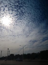 Street against sky during sunset