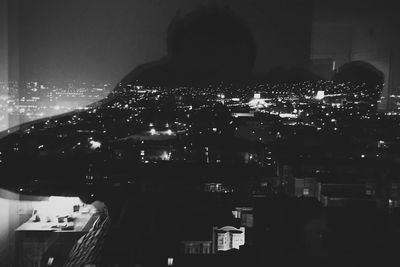 Illuminated cityscape at night