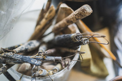 Close-up of wooden equipment in container outdoors