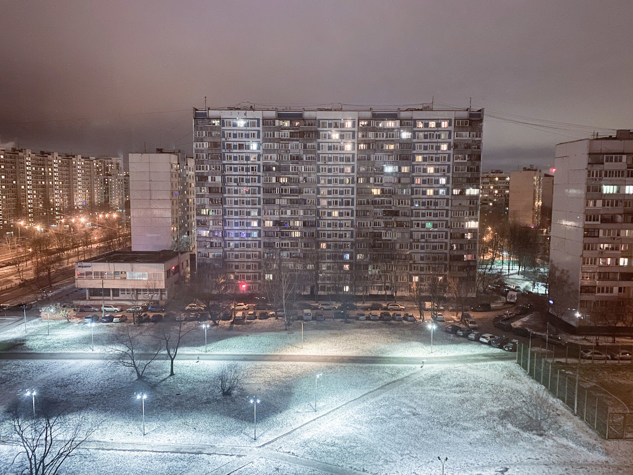 ILLUMINATED CITY BUILDINGS AT NIGHT