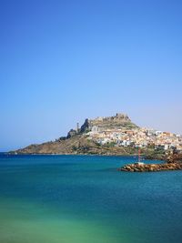 Scenic view of sea against clear blue sky