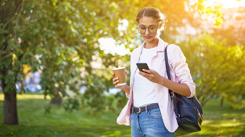 Young woman using mobile phone